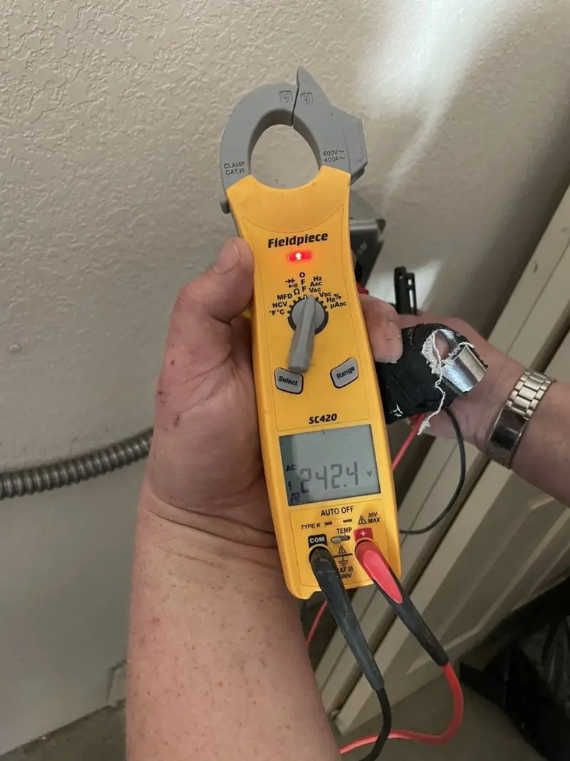 Voltage testing with clamp meter during Recessed Lighting Installation in Marlboro Meadows
